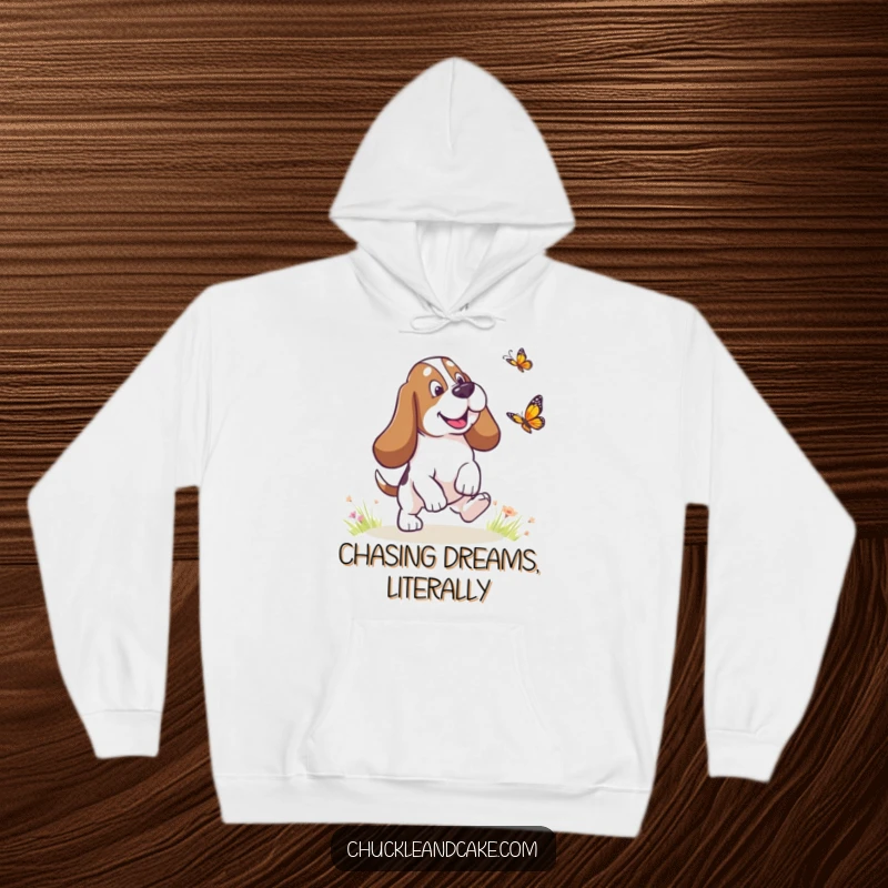 Funny Basset Hound with droopy ears chasing a butterfly, cozy dog hoodie, humorous pet apparel, perfect warm funny gift.