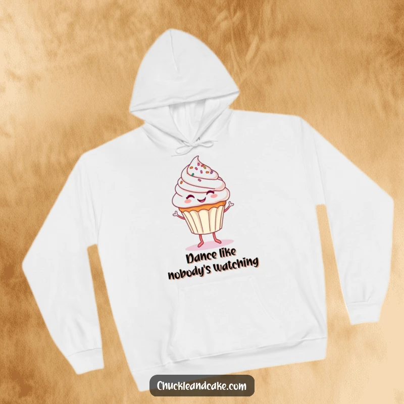 Funny hoodie depicting a smiling cupcake with sprinkle-covered frosting and tiny legs, executing a happy dance, full of whimsical fun.