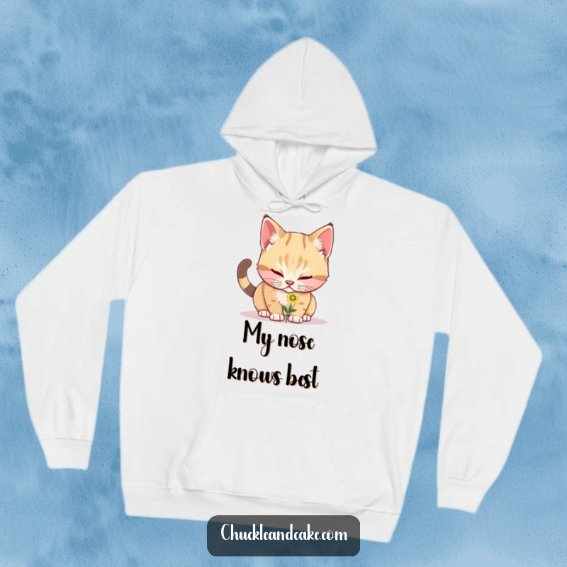 Funny Bobtail cat peeking at a small flower, detailed on a warm and cozy hoodie, perfect for chilly days and chuckles.