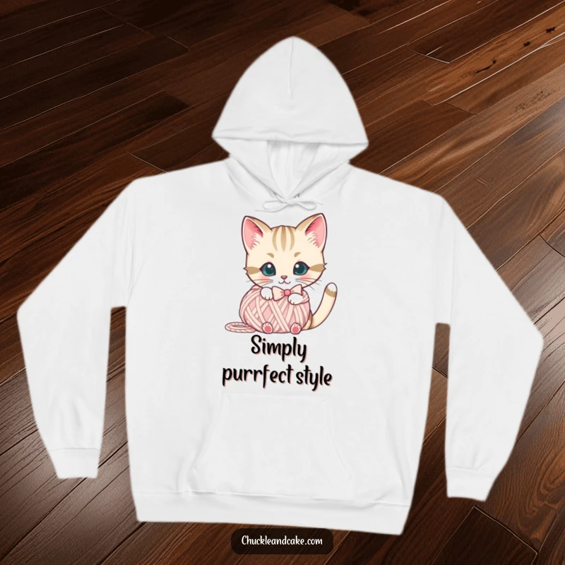 Funny Bobtail cat hoodie featuring a cute cat with a bow peeking from behind a yarn ball, ideal for cozy days.