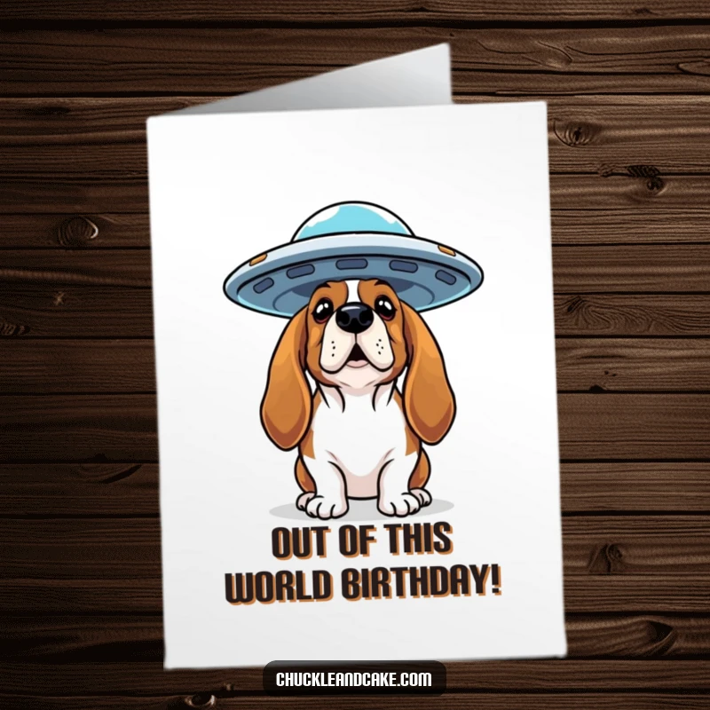 Funny Free Printable Birthday Card: Basset Hound looks up curiously at a hovering flying saucer in the sky.
