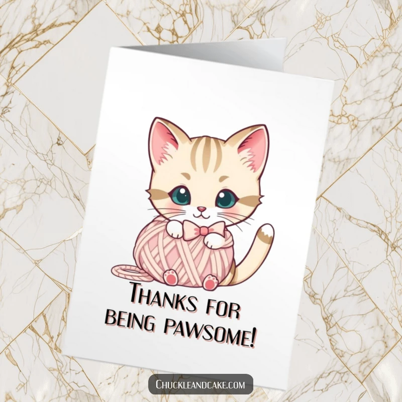 Free Printable Thank You Card: A Bobtail cat wearing a bow peeks out from a yarn ball, sending thanks.
