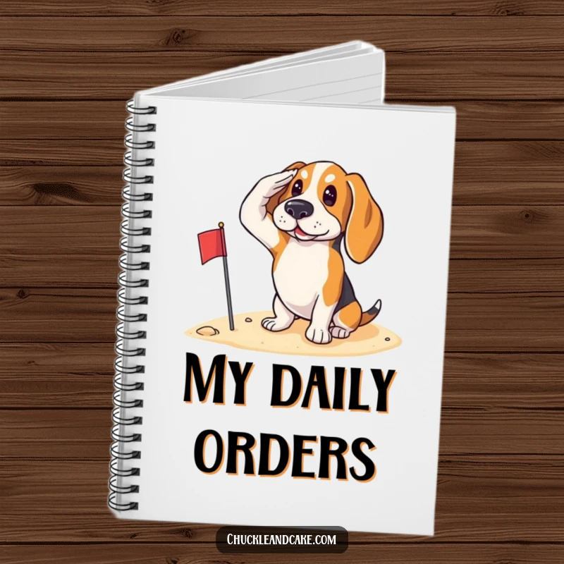 Funny Basset Hound saluting with a small flag on the sand, looking patriotic, featured on a notebook cover.