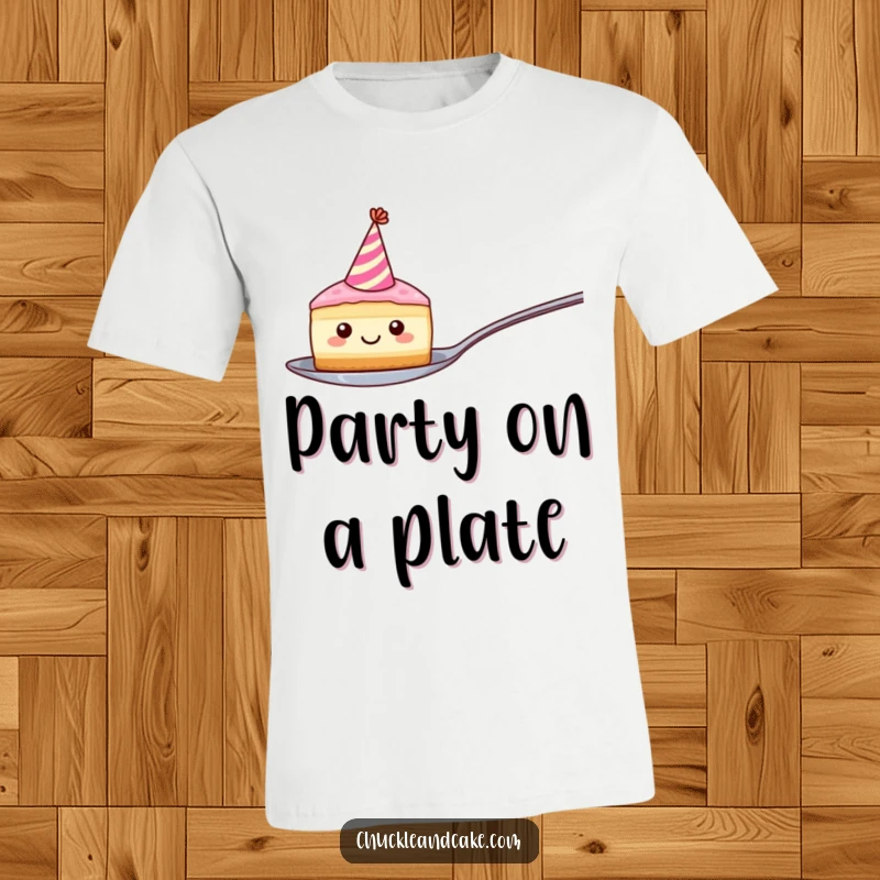 Funny t-shirt with a smiling, round cake slice wearing a party hat, comically balancing on a spoon, showcasing pure, delightful fun.