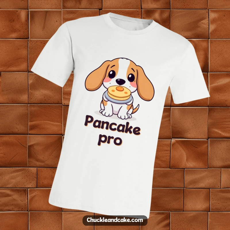 Funny Basset Hound T-Shirt proudly presenting a small pancake, capturing a goofy dog's love for breakfast treats.