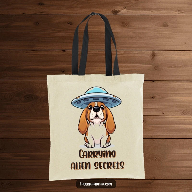 Funny Basset Hound tote bag with a curious dog looking up at a flying saucer, great for carrying books and mysteries.