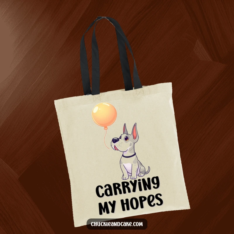 Funny Grand Dane tote bag illustrating a large dog looking up with innocent awe at a playfully floating balloon.