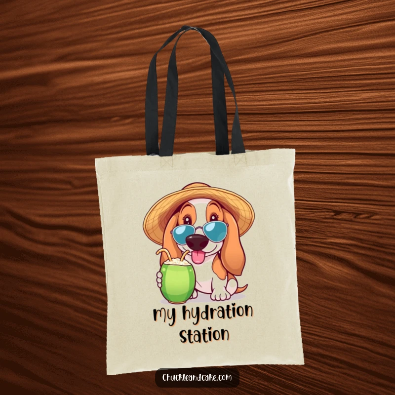Funny Basset Hound tote bag featuring a Basset Hound in a sun hat sipping a coconut drink, perfect for beach lovers and dog moms.